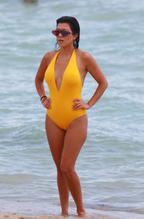 Kourtney KardashianSexy in Kourtney Kardashian Sexy  in Yellow Swimsuit at the Beach in Miami 