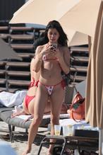 Veronica RodriguezSexy in Veronica Rodriguez shows off her sexy butt in a red-white thong bikini with her pals at the beach in Miami Beach