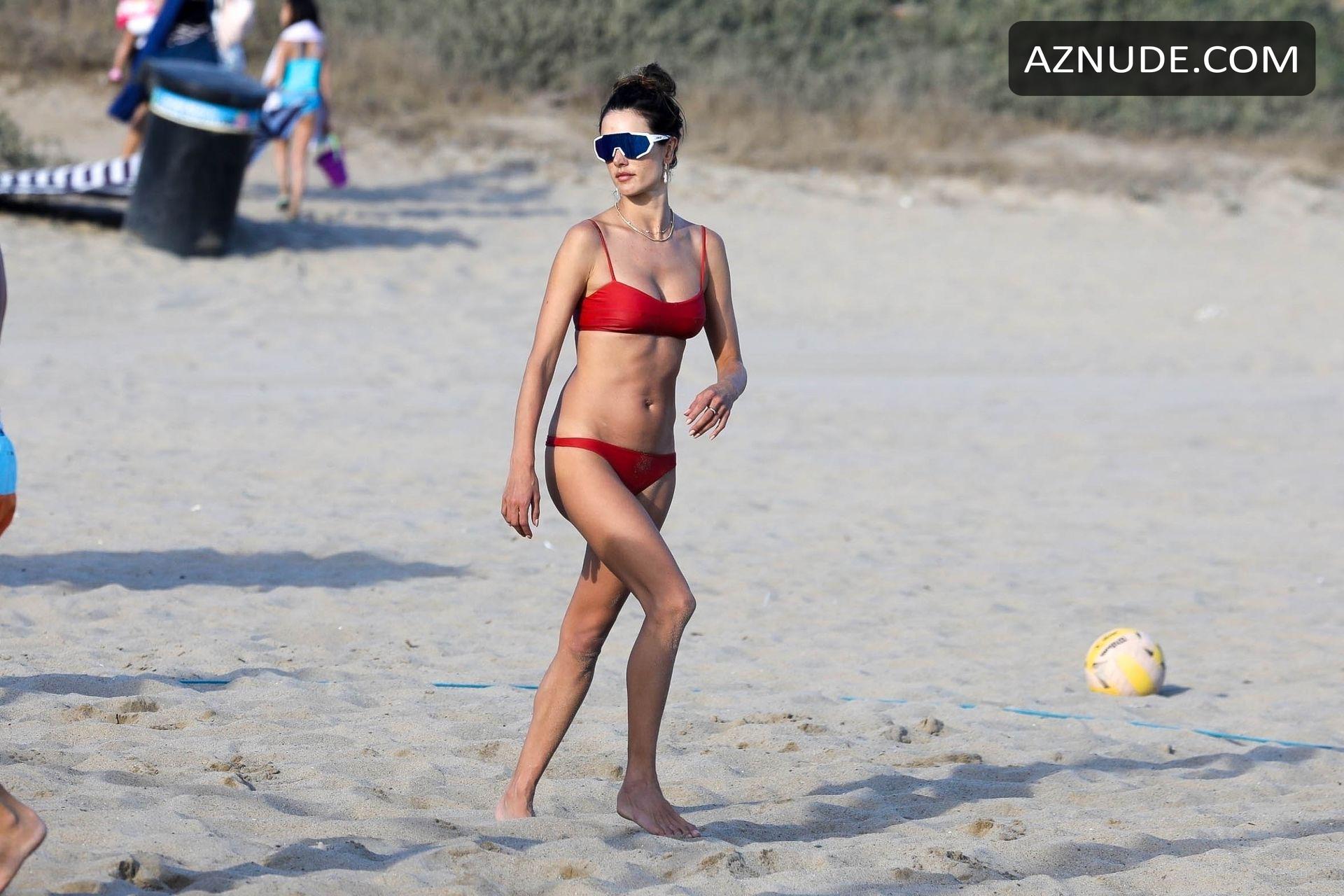 Alessandra Ambrosio In A Red Bikini While Out Playing