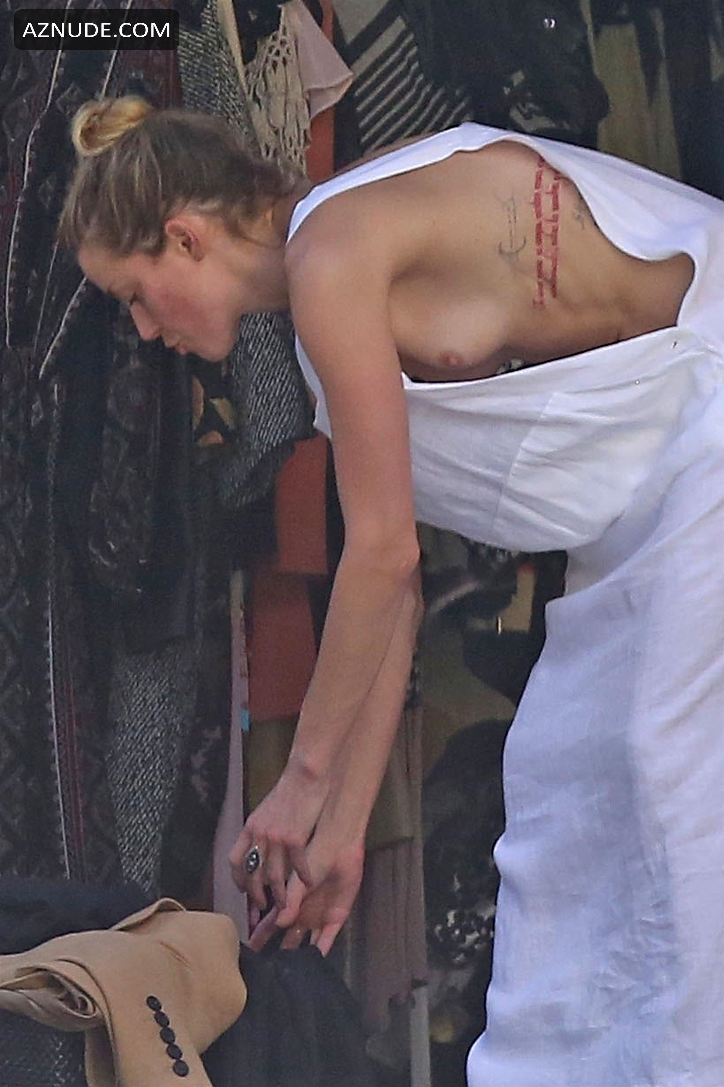 Amber Heard Nip Slip Exposes Boob While Cleaning Out Her Garage In La