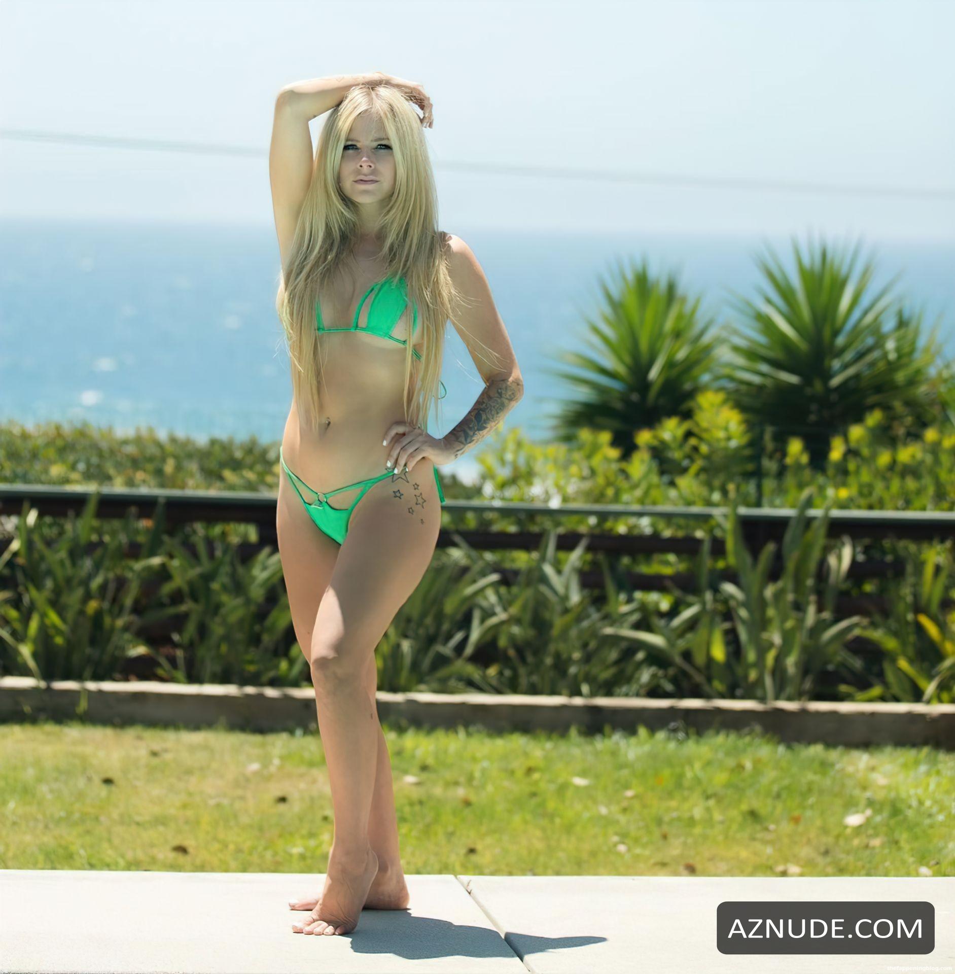 Avril Lavigne Poses In Green Bikini In Malibu - AZNude