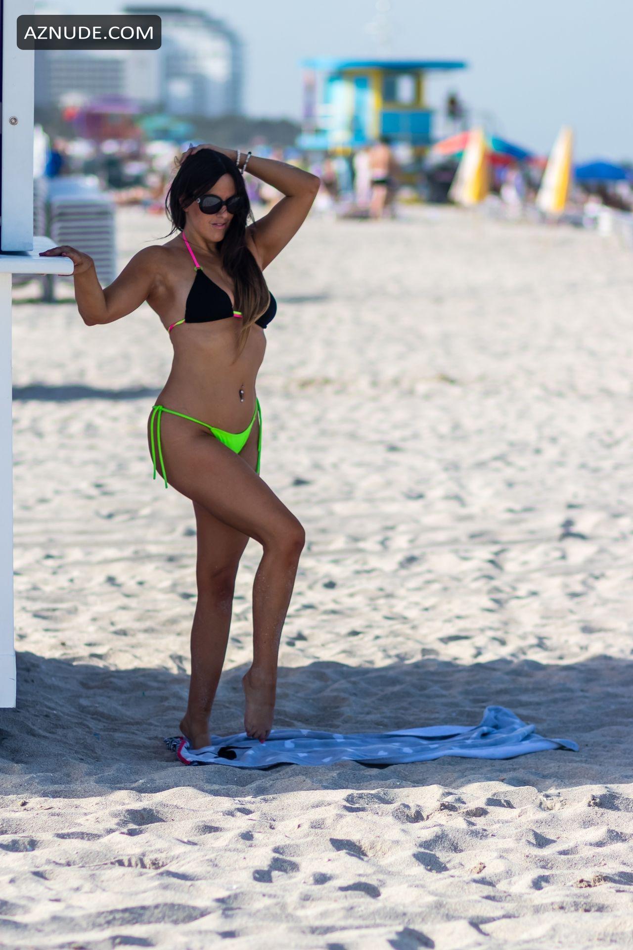 Claudia Romani Sexy In A Neon Lime Black And Pink Thong Bikini While