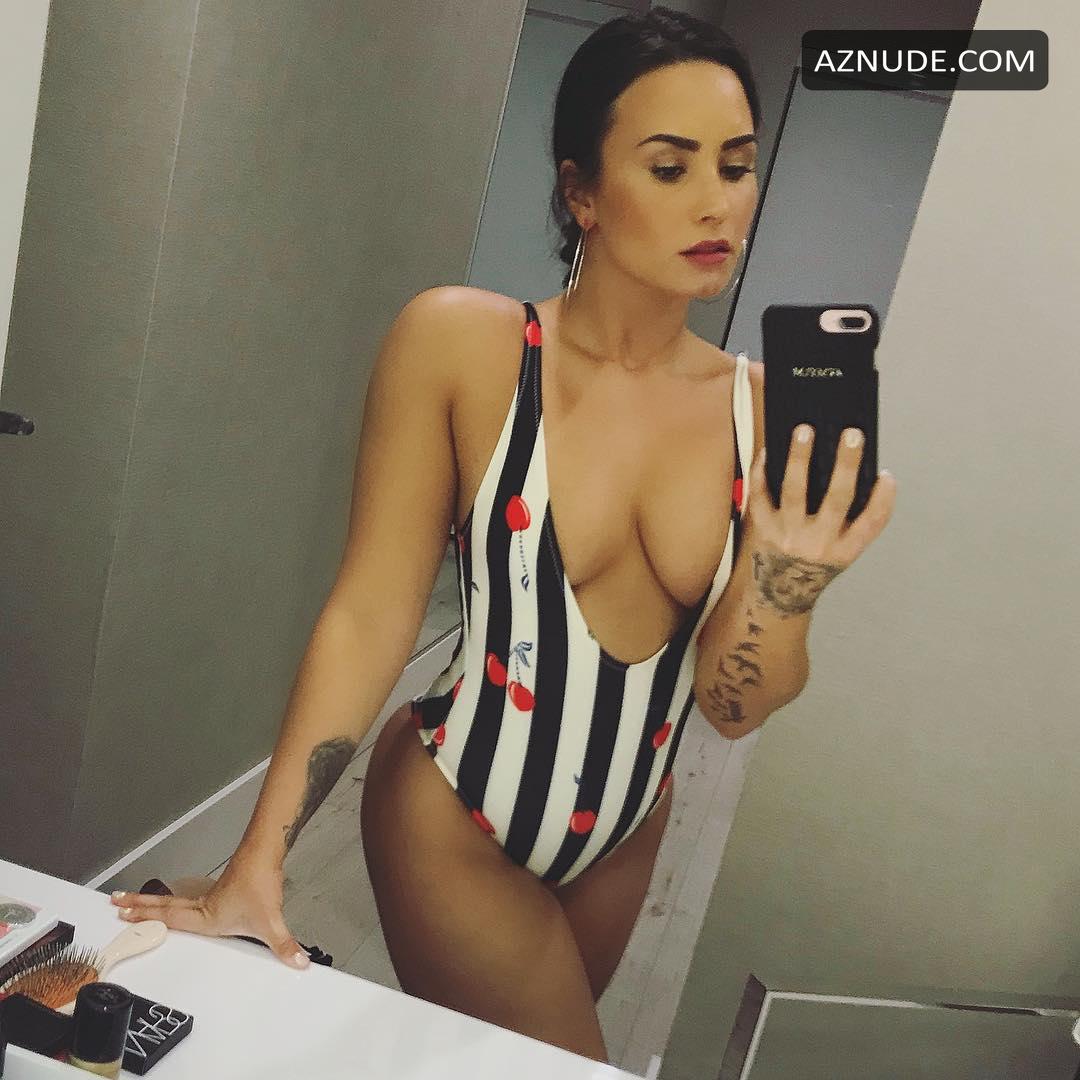 Demi Lovato Shows Her Cleavage And Butt In A Bathing Suit