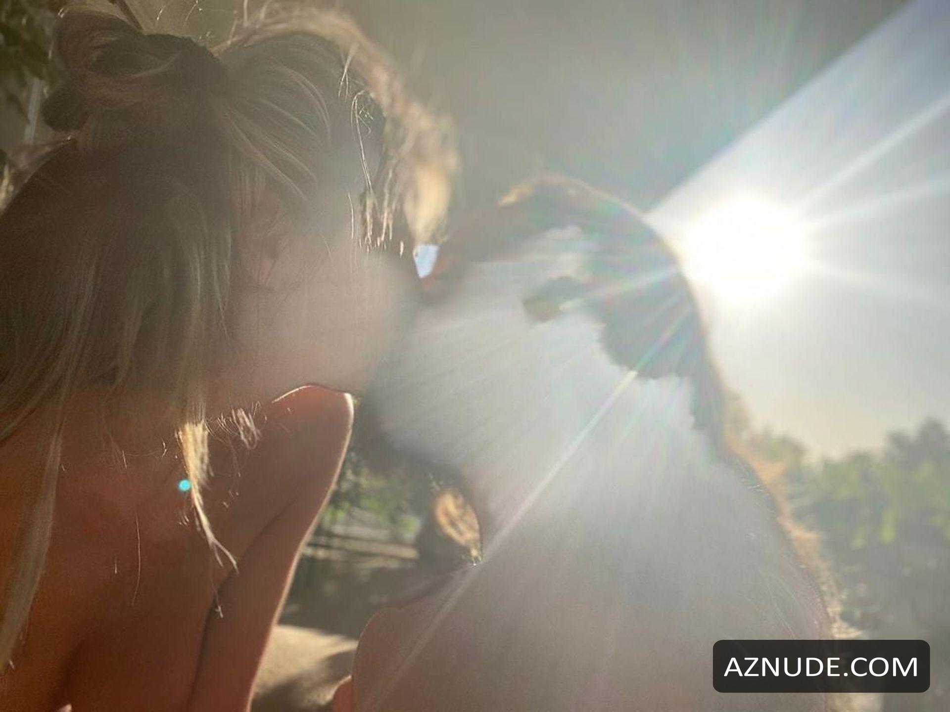 Heidi Klum Goes Topless And Shares A Kiss With Her Husband