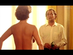 Corinne Touzet Sexy Shows Off Her Busty Cleavage