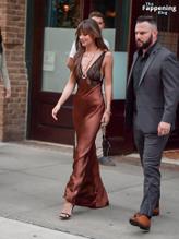 Dakota JohnsonSexy in Dakota Johnson Sexy Dazzles In A Hot Copper Silk Gown As She Leaves A Hotel In New York City