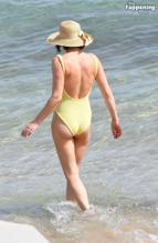 Gemma ArtertonSexy in Gemma Arterton Stuns In A Sexy Yellow Swimsuit At Exclusive Beach Party In Italy