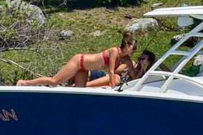 Alessandra AmbrosioSexy in Alessandra Ambrosio parades her sexy model curves in a red bikini while onboard a yacht with family and friends
