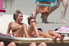 Amber DaviesSexy in Amber Davies showcases her bikini body on the beach in Marbella, Spain