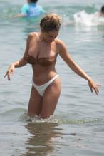 Amber DaviesSexy in Amber Davies showcases her bikini body on the beach in Marbella, Spain