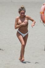 Amber DaviesSexy in Amber Davies showcases her bikini body on the beach in Marbella, Spain