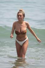 Amber DaviesSexy in Amber Davies showcases her bikini body on the beach in Marbella, Spain