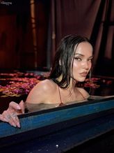  alt="Dove Cameron Sexy in Dove Cameron Sexy Shows Off Her Hot Cleavage And Legs In A Spicy Red Dress For Diesel's Fragrance Campaign Photoshoot"