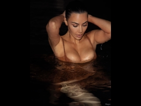 Kim Kardashian Sexy Poses Her Wet Boobs Wearing A Sensual Sheer Dress In A Beach Photoshoot