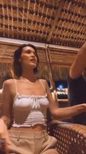 Bella Hadid shows her pokies during dancing braless in a white top in this short TikTok video