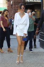 Bella ThorneSexy in Bella Thorne wearing white mini-dress with matching heels and carrying mini Jacquemus tote in New York