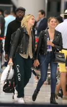 Ashley BensonSexy in Cara Delevingne and Ashley Benson at JFK airport in New York kissing and cuddling in the security line