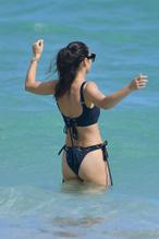 Cara SantanaSexy in Cara Santana Sexy wears a black bikini in Miami Beach, Florida