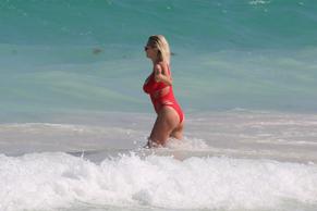 Caroline VreelandSexy in Caroline Vreeland Sexy in Red Swimsuit On the Beach in Mexico 