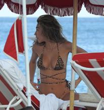 Chantel JeffriesSexy in Chantel Jeffries in an animal print thong bikini while relaxing on a VIP sunbed in Miami Beach with friends