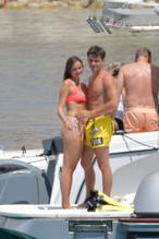 Charlotte Sine and Charles Leclerc having fun abroad a speed boat near Monaco