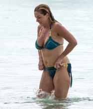 Claire Sweeney dons her teal and gold bikini out in the Caribbean sunshine of Barbados