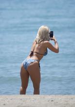 DANIELLEARMSTRONGLOOKSSTUNNINGINASKIMPYBIKINIONTHEBEACHINPUERTOBANUSSPAIN - NUDE STORY