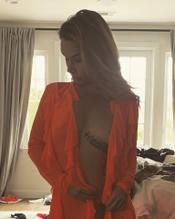 Danielle Harris displays her orange blouse, showing slightly nude tits
