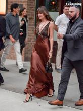 Dakota JohnsonSexy in Dakota Johnson Sexy Dazzles In A Hot Copper Silk Gown As She Leaves A Hotel In New York City