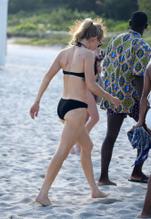 Ellie GouldingSexy in Ellie Goulding hits the beach with husband Caspar Jopling in Miami on New Year's Eve Day