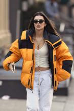 Emily RatajkowskiSexy in Emily Ratajkowski Sexy seen wearing a necklace with Colombo engraved and a yellow north face jacket in cold New York winter day 