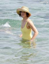 Gemma ArtertonSexy in Gemma Arterton Stuns In A Sexy Yellow Swimsuit At Exclusive Beach Party In Italy