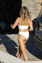 Gigi Hadid in an orange bikini and Mary Butler in white bikini in Mykonos Island, Greece