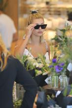 Hailey BaldwinSexy in Hailey Baldwin at Erewhon market in Beverly Hills in a cleavage-baring white ensemble