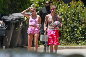 Hailey BaldwinSexy in Hailey Baldwin Bieber wears pink shorts and a pink top as she heads out for coffee with friends on Memorial Day in Beverly Hills