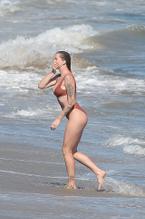 Ireland BaldwinSexy in Ireland Baldwin Frolics in a red one-piece on the beach in Malibu