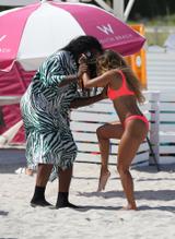 Karrueche TranSexy in Karrueche Tran Sexy in a neon pink bikini as she play nights with a friend on the beach in Miami