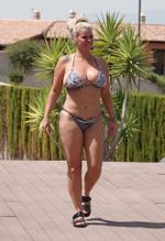 Kerry Katona Sexy in Kerry Katona showing off a whole load of cleavage in her skimpy multicolored bikini