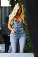 Khloe Kardashian arrives at a studio in Los Angeles in double denim and peep-toe heels