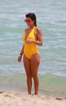 Kourtney KardashianSexy in Kourtney Kardashian Sexy  in Yellow Swimsuit at the Beach in Miami 