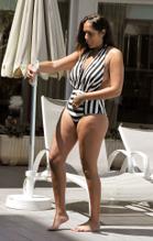 Malin AnderssonSexy in Malin Andersson Sexy pictured with her striped swimsuit poolside on holiday in Spain