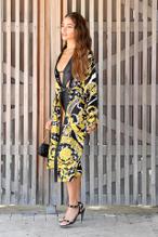 Olivia CulpoSexy in Olivia Culpo wears a Versace robe with a black swimsuit in Miami Beach, Florida