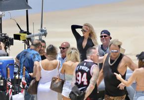 Pamela AndersonSexy in Pamela Anderson Sexy films Ultra Tune TV Ad on Gold Coast Beach in Australia