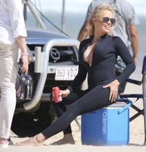 Pamela AndersonSexy in Pamela Anderson Sexy films Ultra Tune TV Ad on Gold Coast Beach in Australia
