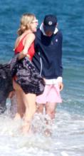 Paris Hilton and Carter Reum on the beach with her new puppy dog