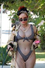 Phoebe Price in a bikini while out walking her dog in Los Angeles