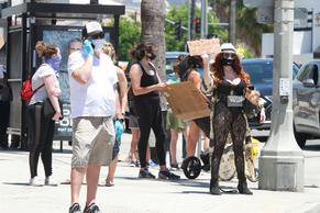 Phoebe PriceSexy in Phoebe Price joins other protesters on Sunday for Black Lives Matter and remembering George Floyd