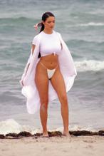 Tao WickrathSexy in Tao Wickrath Sexy wears a flowing white swimsuit on Miami Beach