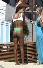 Tina KunakeySexy in Tina Kunakey hits the beach dressed in her skimpy green bikini in Mykonos Island