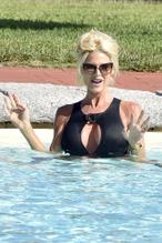 Victoria SilvstedtSexy in Victoria Silvstedt wearing her black swimsuit on holiday in Cala Di Volpe in Sardinia, Italy